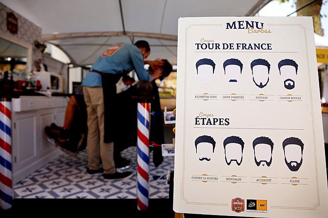 Reinardt Janse van Rensburg of South Africa and MTN-Qhubeka visits the barber shop in Tarbes, France, the start village before Stage 10 of the Tour de France,a 167 km stage between Tarbes and La Pierre-Saint-Martin, on July 14