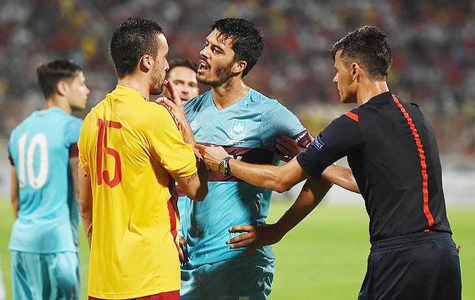 West Ham's James Tomkins is clashes with Birkirkara's Nikola Vukanac during their UEFA Europa League Second Qualifying Round Second Leg match at Ta' Qali National Stadium in Malta on Thursday