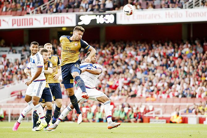 Arsenal's Olivier Giroud scores their first goal against Olympique Lyonnais during the Emirates Cup Pre-Season friendly tournament at Emirates Stadium in London on Saturday