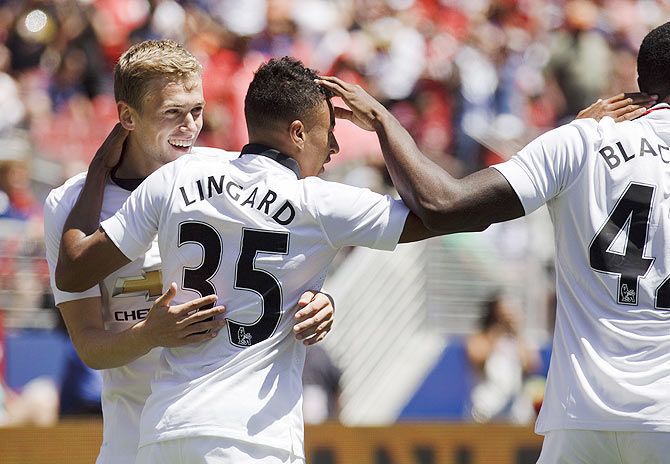 Manchester United's Jesse Lingard (centre) celebrates scoring the second goal with James Wilson and Tyler Blackett during their International Champions Cup Pre-season friendly at Levi's Stadium, in Santa Clara, California on Saturday