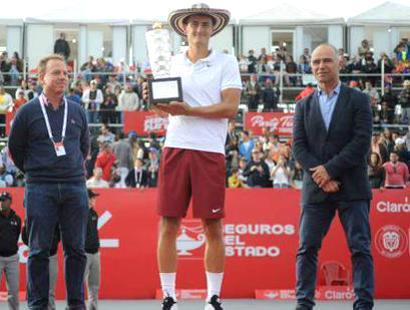 Australian Bernard Tomic with the trophy after winning the ATP title in Bogota on Sunday