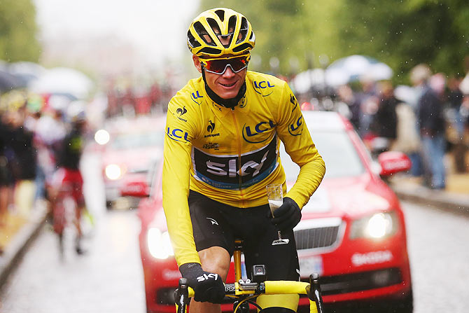 Chris Froome of Great Britain and Team Sky celebrates his overall victory with a glass of champagne during the 21st stage of the 2015 Tour de France, a 109.5 km stage between Sevres and Paris Champs-Elysees, in Paris on Saturday