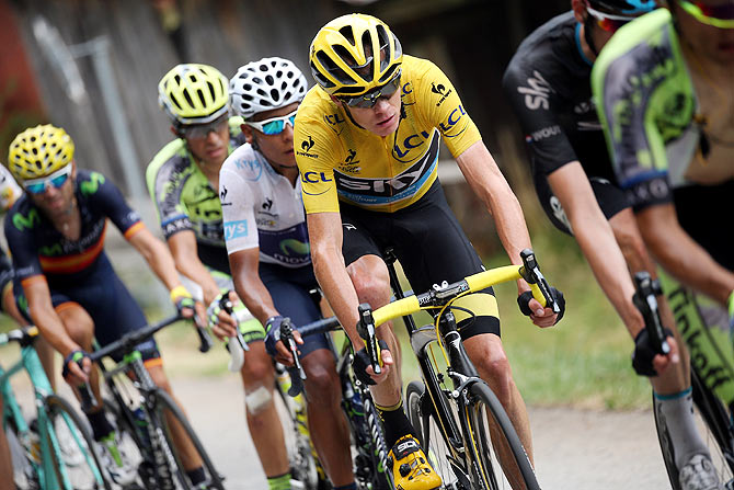 Chris Froome of Great Britain riding for Team Sky in the overall race leader yellow jersey is followed by Nairo Quintana (3rd from left) of Colombia riding for Movistar Team in the best young rider white jersey, Alberto Contador (2nd from left) of Spain riding for Tinkoff-Saxo and Alejandro Valverde (left) of Spain riding for Movistar Team during Stage 19