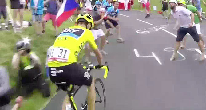 A video grab shows Briton rider Chris Froome being spat on by a spectator on the 19th stage of the Tour de France