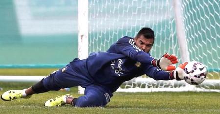 Argentina's goalkeeper Sergio Romero blocks a shot during a training session in La Serena