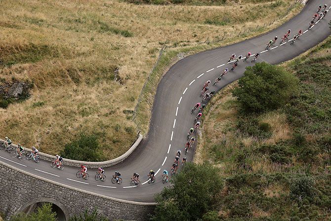 The peloton makes the descent of the Col de la Croix de Bauzon during Stage 15 from Mende to Valence, in La Souche, France, on July 19