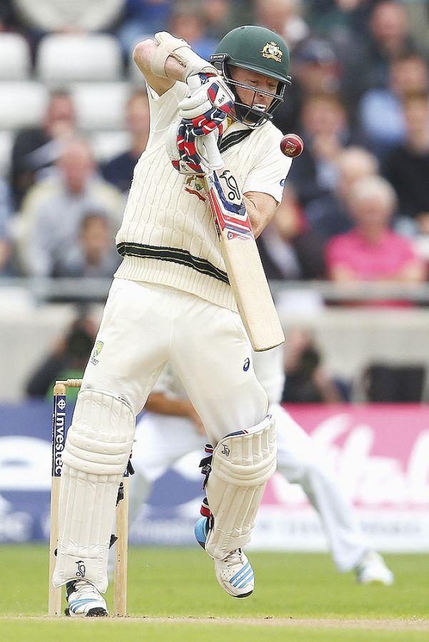 Australia's Chris Rogers evades a sharp, rising delivery