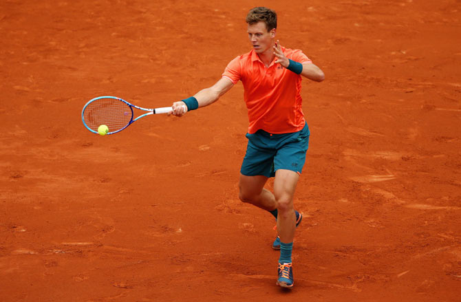 Czech Republic's Tomas Berdych plays a forehand against France's Jo-Wilfried Tsonga
