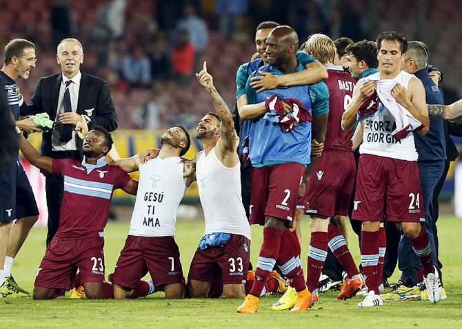 Lazio's players celebrates at the end of their Serie A match against Napoli at the San Paolo stadium in Naples, Italy, on Sunday