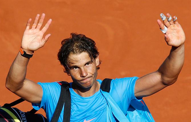 Rafael Nadal of Spain leaves the court