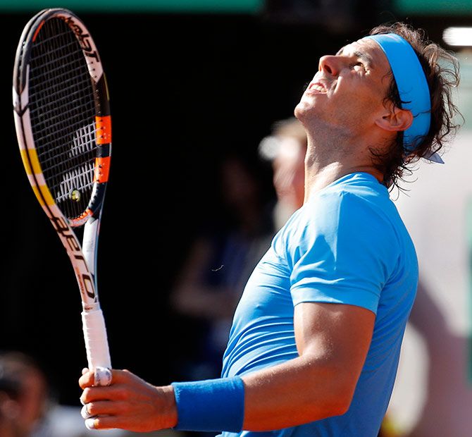 Rafael Nadal reacts during his men's quarter-final match against Novak Djokovic