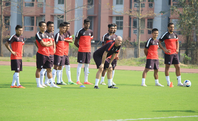India football team coach with players during a training session
