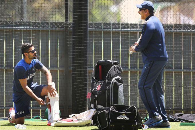 Virat Kohli and Ravi Shastri share a light moment during training