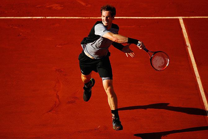 Andy Murray plays a forehand return against David Ferrer during their French Open quater-final on Wednesday