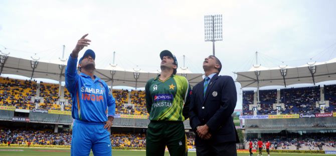 India captain Mahendra Singh Dhoni (left) with Pakistan captain Misbah-ul-Haq at the toss during an ODI match in Chennai in December 2012