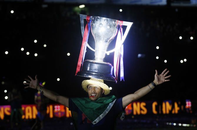 Barcelona's Adriano celebrates with the Champions League trophy