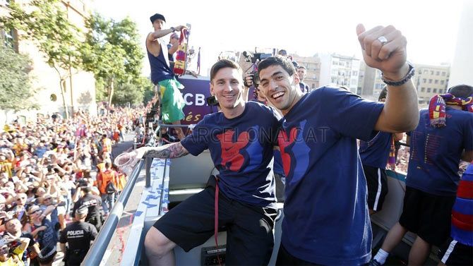 FC Barcelona's strike force of Lionel Messi, Luis Suarez and Neymar (left) celebrate