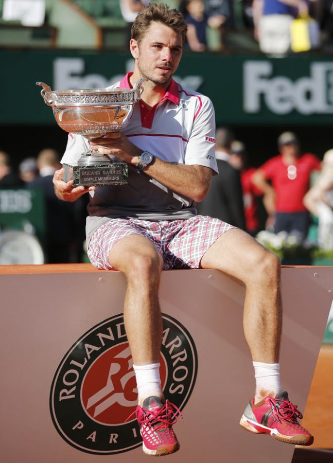 Switzerland's Stanislas Wawrinka poses with the trophy during the ceremony after winning the French Open men's singles final against Serbia's Novak Djokovic at the French Open at the Roland Garros stadium in Paris on Saturday