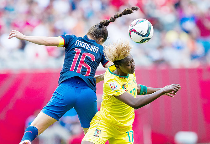 Cameroon's Gaelle Enganamouit (right) and Ecuador's Ligia Moreira battle for the ball during their FIFA Women's World Cup Group C match at BC Place Stadium in Vancouver, British Columbia, Canada, on Monday