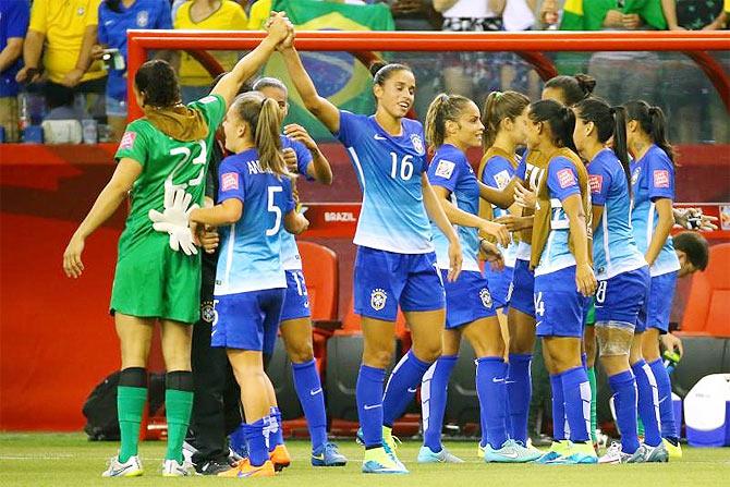 Brazilian players celebrate at the end of their Group E soccer match against Spain in the 2015 FIFA women's World Cup at Olympic Stadium in Montreal, Quebec on Saturday