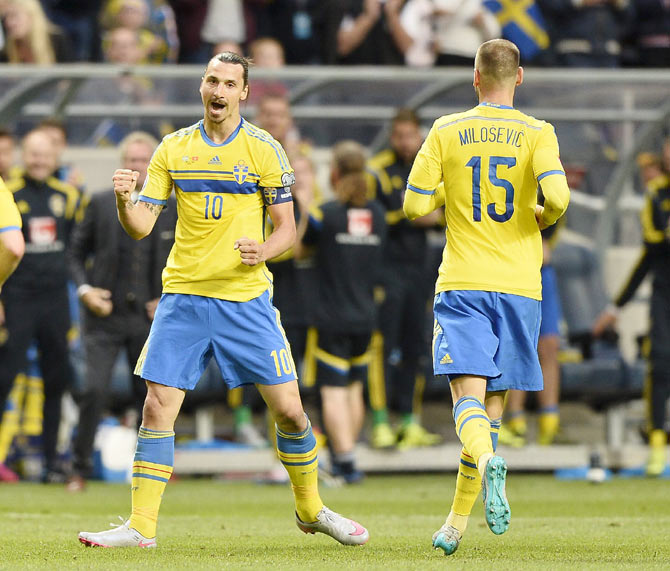 Swedens' Zlatan Ibrahimovic (left) celebrates with teammate Jublar Alexander Milosevic after netting a goal against Montenegro during their UEFA Euro 2016 Group G qualifying match at Friends Arena in Stockholm, Sweden on Sunday