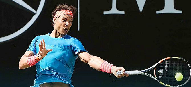 Rafael Nadal plays a return