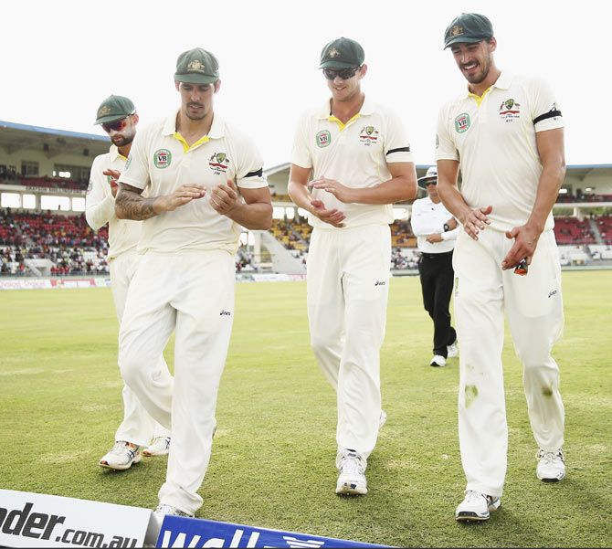 Australia bowlers (from left) Nathan Lyon, Mitchell Johnson, Josh Hazlewood and Mitchell Starc walk off the field