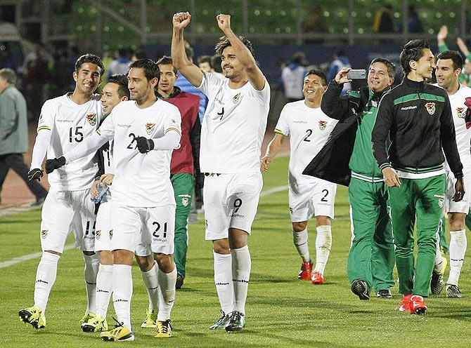 Bolivia players celebrate after defeating Ecuador