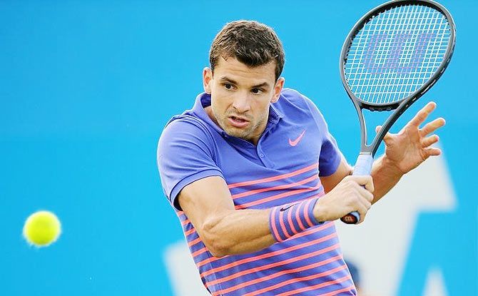 Bulgaria's Grigor Dimitrov in action against American Sam Querrey during the first round of the Queen's Club championship in London on Monday