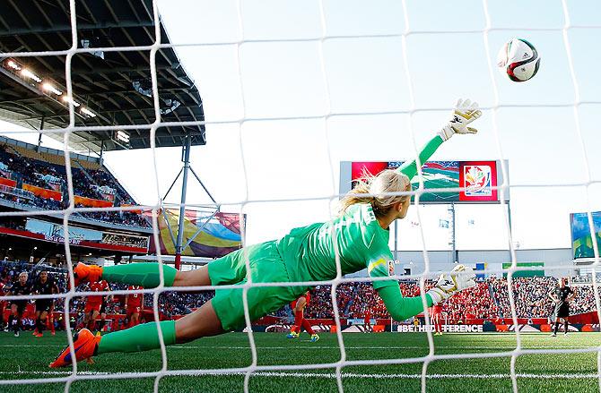 New Zealand's Goalkeeper Erin Nayler fails as she dives to stop a goal scored off a penalty by China's Wang Lisi