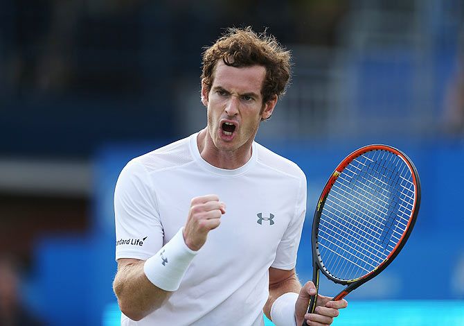 Andy Murray of Great Britain celebrates a point in his men's singles first round match against Yen-Hsun Lu of Chinese Taipei