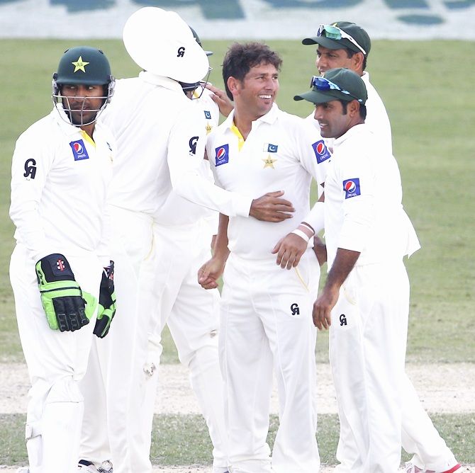 Yasir Shah of Pakistan celebrates with teammates