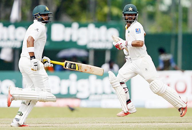 Pakistan's Ahmed Shehzad (right) and Azhar Ali run between wickets on Day 3 of the second Test match against Sri Lanka in Colombo on Saturday