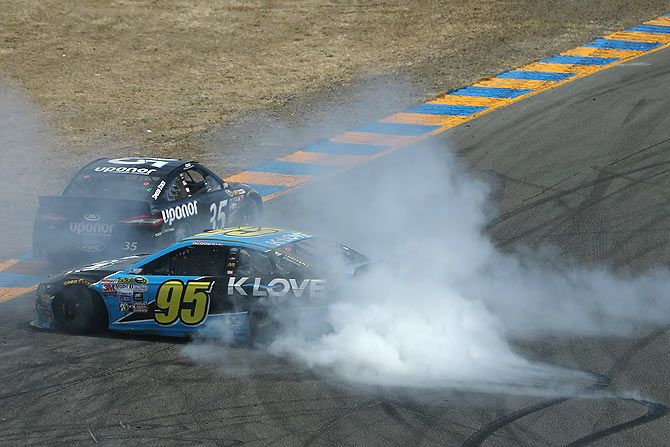 Michael McDowell, driver of the #95 KLOVE Radio Ford, is involved in an on-track incident during the NASCAR Sprint Cup Series Toyota/Save Mart 350 at Sonoma Raceway in Sonoma, California, on June 28