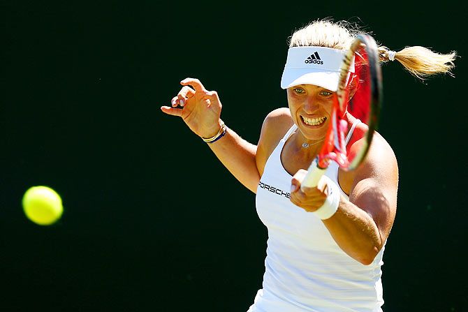 Germany's Angelique Kerber plays a forehand in her first round match against compatriot Carina Witthoeft
