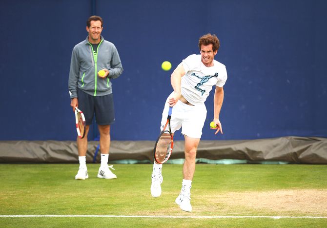Great Britain's Andy Murray is watched by coach Jonas Bjorkman as he practices