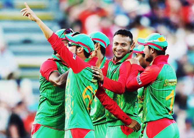 Bangladesh players celebrate a wicket