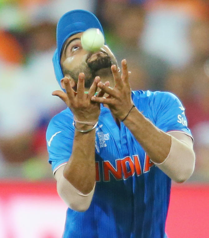 India's Virat Kohli takes a catch to dismiss Shahid Afridi of Pakistan during their match at Adelaide Oval on February 15
