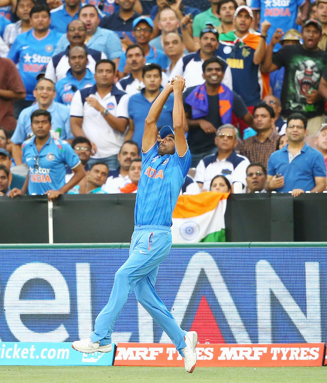 Mohammed Shami of India takes a catch to dismiss Hashim Amla of South Africa during their match at Melbourne Cricket Ground on February 22