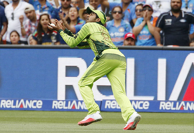 Pakistan's Haris Sohail catches out India's batsman Suresh Raina during their match in Adelaide on February 15