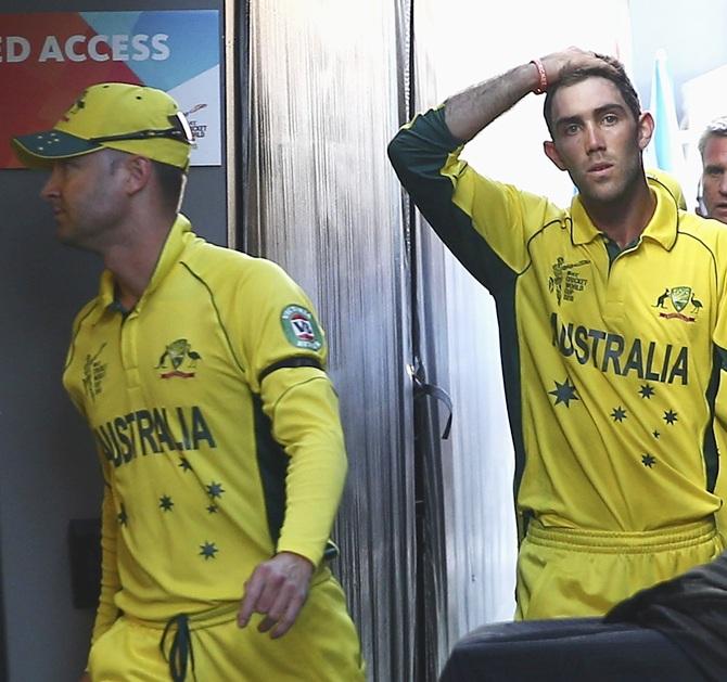 Michael Clarke and Glenn Maxwell of Australia leave the ground 