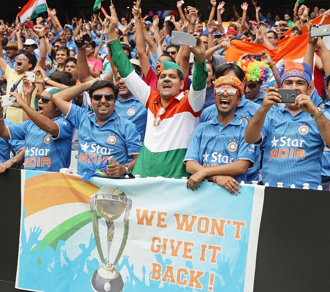 Supporters stand for the national anthems during the 2015 ICC Cricket World Cup match between South Africa and India at Melbourne Cricket Ground