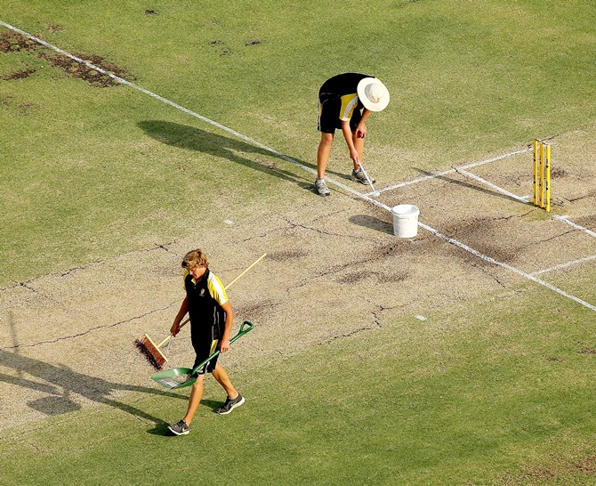 Groundsmen paint the crease at The WACA