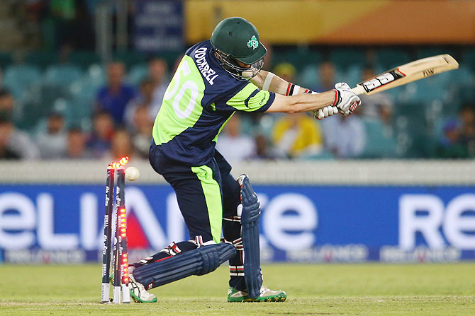 George Dockrell of Ireland is bowled by Morne Morkel of South Africa