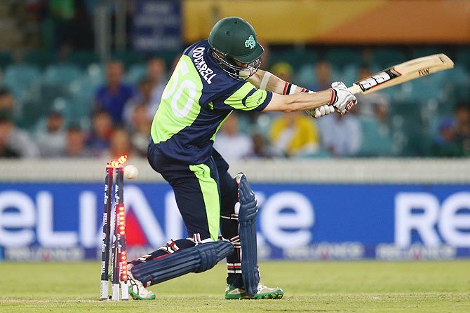 George Dockrell of Ireland is bowled by Morne Morkel of South Africa