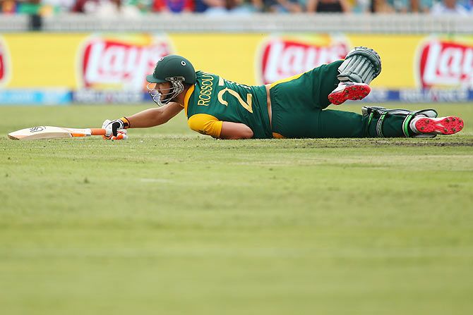 Rilee Rossouw of South Africa falls as he bats 