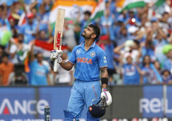 Virat Kohli looks to the sky after scoring a century during the World Cup match against Pakistan in Adelaide