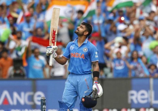 Virat Kohli looks to the sky after scoring a century during the World Cup match against Pakistan in Adelaide