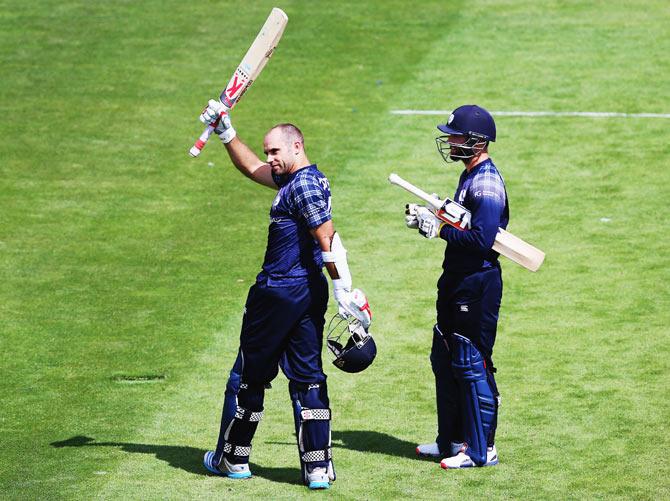 Kyle Coetzer of Scotland celebrates after scoring a century against Bangladesh