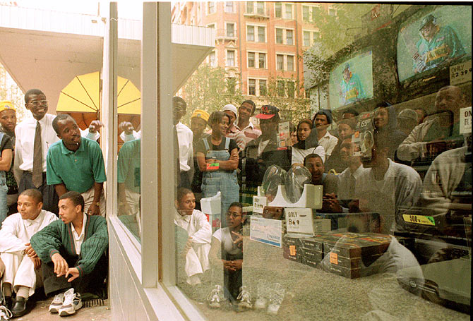 South African cricket fans watch outside an appliance store as their team loses another wicket in the 1996 Cricket World Cup quarter-final against the West Indies on March 11 1996. South Africa eventually lost the match